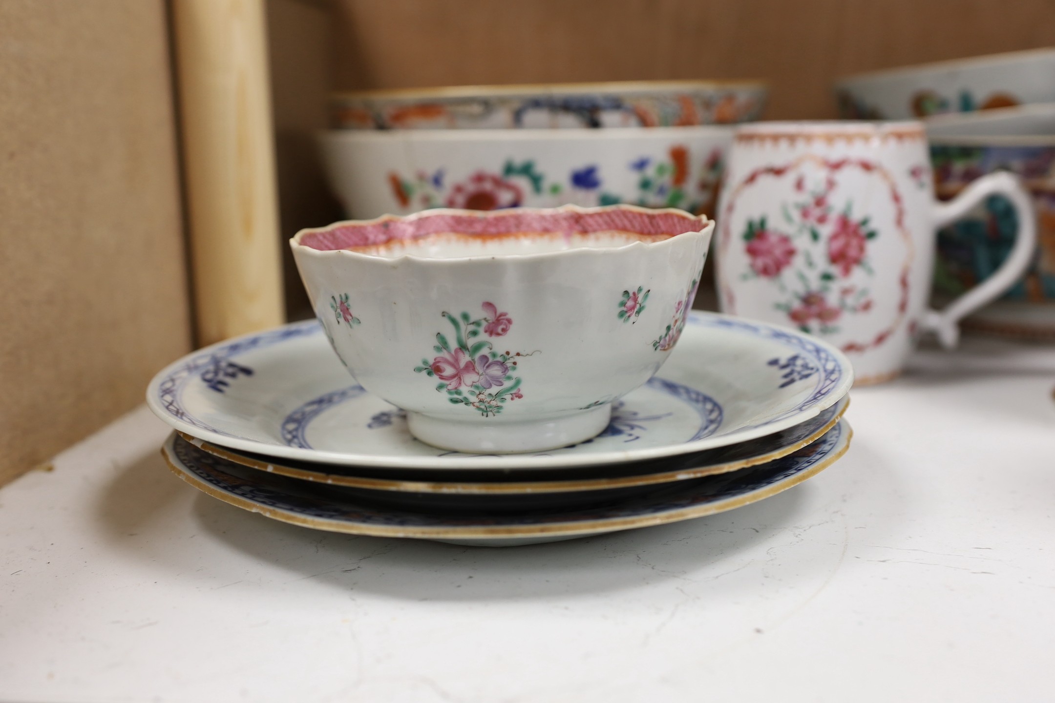 A large selection of 18th century Chinese export porcelain bowls, plates and mugs a/f
